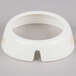 A white circular plastic collar with a hole in it.