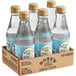 A clear glass bottle of blue Rose's Simple Syrup.