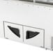 A white Turbo Air ice cream dipping cabinet with black handles.