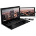 A Luxor SideTrak portable monitor attached to a laptop with a cityscape on the screen.