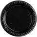 A black Huhtamaki Chinet plastic plate with a decorative border.