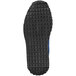 The navy blue sole of a Reebok Work Harman women's athletic shoe with blue squares.