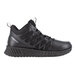 A black mid-high athletic shoe with mesh and synthetic overlays, designed for men with a wide width and a non-slip sole.