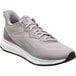 A close up of a gray and white Reebok Work athletic shoe with a non-slip sole.