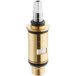 A brass Chicago Faucets water valve cartridge with a black and gold cap.