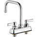 A silver Chicago Faucets deck-mounted faucet with two handles.