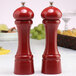 A Chef Specialties candy apple red salt and pepper mill set on a table.