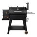A black Pit Boss barbecue grill with a silver handle.