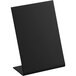 A black rectangular chalkboard sign on a black stand.