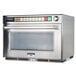 A Panasonic Sonic Steamer commercial microwave oven with a digital display on a glass door.