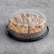 Hahn's Bakery Chocolate German Crumb Cake in a plastic container on a table in a bakery display.