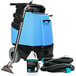 A blue Mytee carpet extractor with a hose and canister.