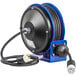 A blue and black Coxreels PC10 Series compact power cord reel with a power cord.