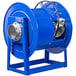 A blue Coxreels 300 Series exhaust extraction reel on a stand with a black hose.