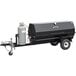 A black trailer with a grey gas cylinder attached to a large black Meadow Creek gas pig roaster.