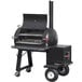 A black Meadow Creek barbecue smoker on wheels.