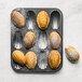 A de Buyer Madeleine pan filled with Madeleines.