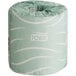 A roll of white Tork 2-ply toilet paper with a Tork logo.