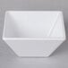 A white square GET Siciliano melamine bowl.