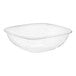 A clear plastic Visions square bowl with curved edges.