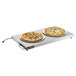 A plate with two pizzas on a Vollrath heated shelf.