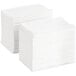 A stack of Tork white interfold dispenser napkins.