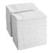 A stack of Tork white paper napkins.