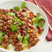 A bowl of rice, Beyond Meat Seared Steak Tips, and vegetables.