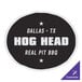 A black and white rectangular vinyl magnet with white text that reads "Dallas Texas Hog Head Real Pit Bull" on a table.