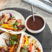 A plate of tacos with Knorr Fajita Sauce.