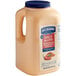 A plastic jug of Hellmann's Spicy Mayonnaise.