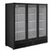A large black refrigerated merchandiser with three glass swing doors and interior shelving.