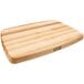 A John Boos maple wood cutting board with a grooved and reversible surface.