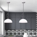 A kitchen with a Canarm brushed nickel pendant light over a white table.