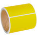 A roll of yellow Lavex thermal transfer labels with white stripes.