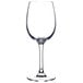 A close-up of a clear Chef & Sommelier wine glass with a stem.