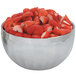 A Vollrath fluted metal bowl filled with strawberries.