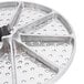 A circular stainless steel metal plate with holes in it.