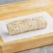 An El Monterey breakfast burrito on a cutting board.