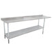 An Advance Tabco stainless steel work table with undershelf.