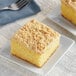 A piece of cake on a square plate with Rich's Streusel Crumb Topping.
