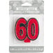 A red glitter birthday candle shaped like the number 60 with black accents.