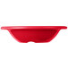 A red Carlisle melamine bowl with a white rim.