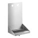 A Regency stainless steel wall mounted beer drip tray with 2 faucets over a bar counter.