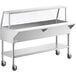A stainless steel ice-cooled food table with a sneeze guard on wheels.