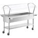 A stainless steel ServIt cold food table with a clear cover over the food pans.