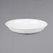 a white bowl on a gray background