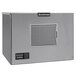 A Scotsman air cooled small cube ice machine with a grey rectangular vent on the front.