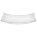A Vollrath stainless steel curved platter with a white background.