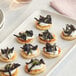 A plate of small appetizers with Dried Black Trumpet Mushrooms.